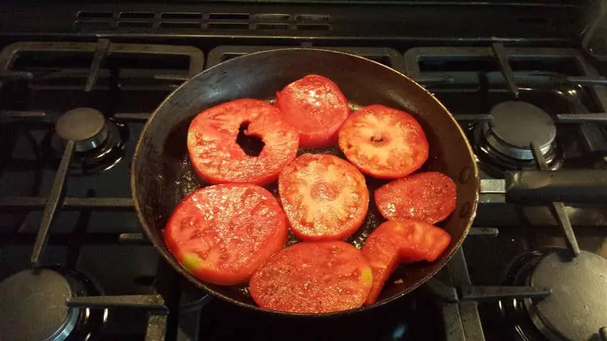 large heritage tomatoes in pan